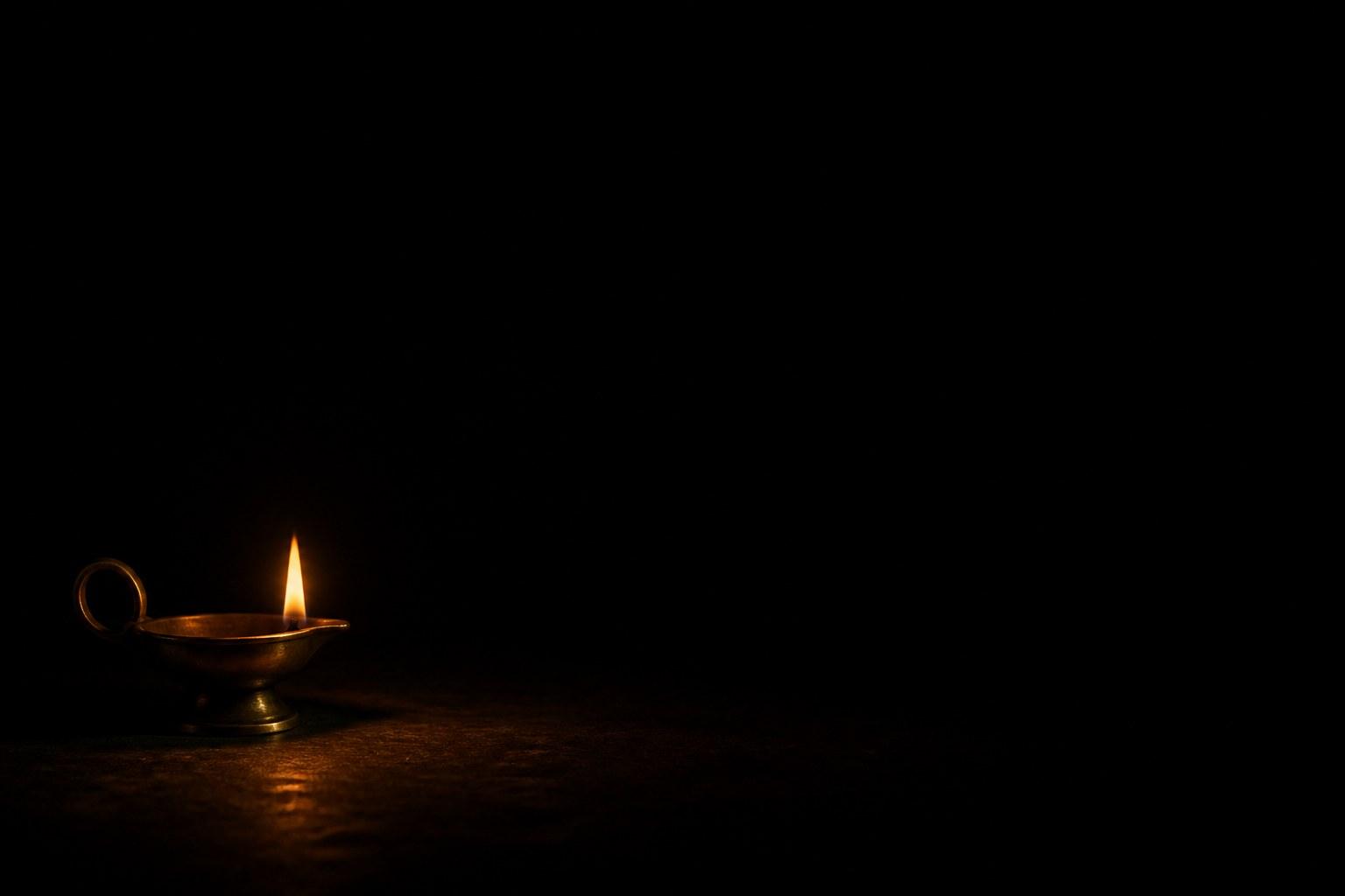 Single brass oil lamp flame in a dark void, holding image for the Resilient Mind inquiry episode